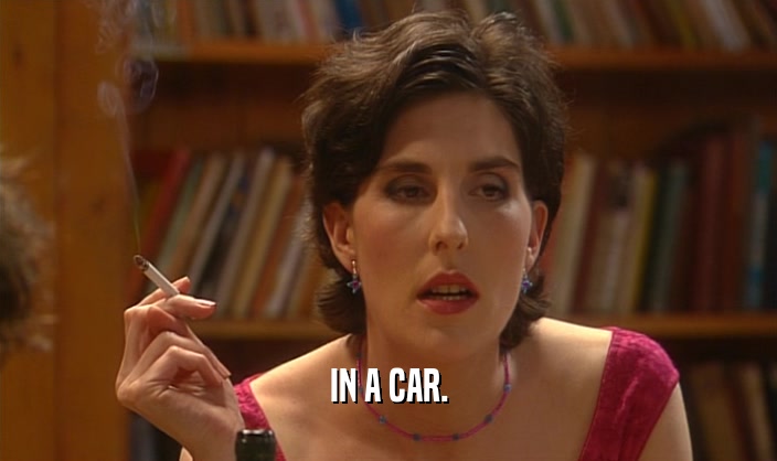 IN A CAR.  