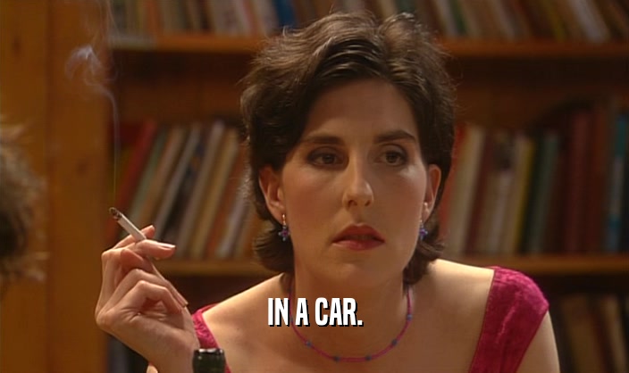 IN A CAR.  