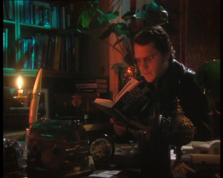 SOMETHING WAS POURING FROM HIS MOUTH. HE EXAMINED HIS SLEEVE. 