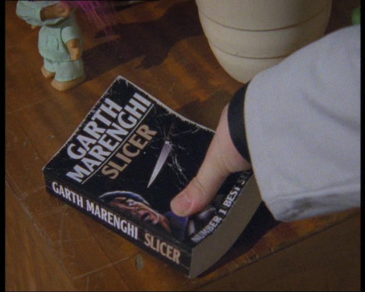 'HAVE A THUMB OF THIS. IT LOOKS LIKE A TAWDRY HORROR PAPERBACK 