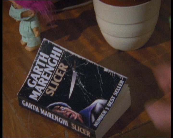 'HAVE A THUMB OF THIS. IT LOOKS LIKE A TAWDRY HORROR PAPERBACK 