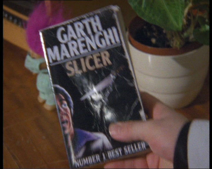'HAVE A THUMB OF THIS. IT LOOKS LIKE A TAWDRY HORROR PAPERBACK 