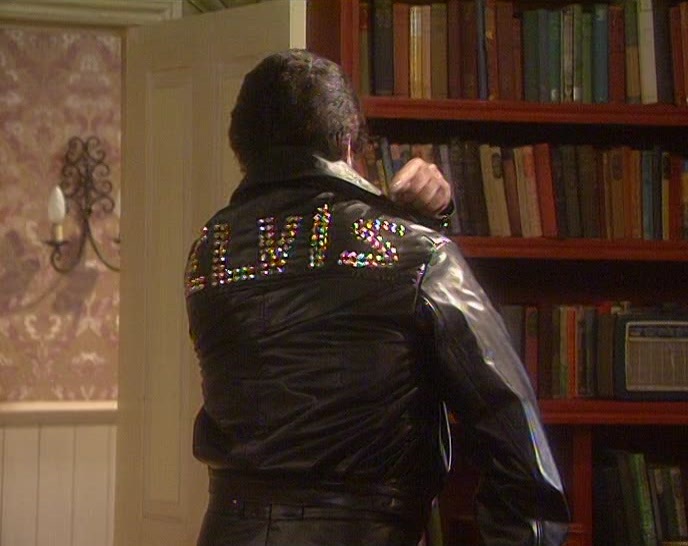 OF COURSE. I'VE GOT ELVIS WRITTEN ON MY BACK. I DON'T BELIEVE THIS. 