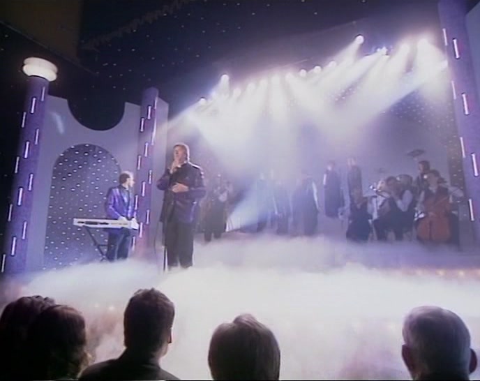 (CHOIR JOINS IN)  