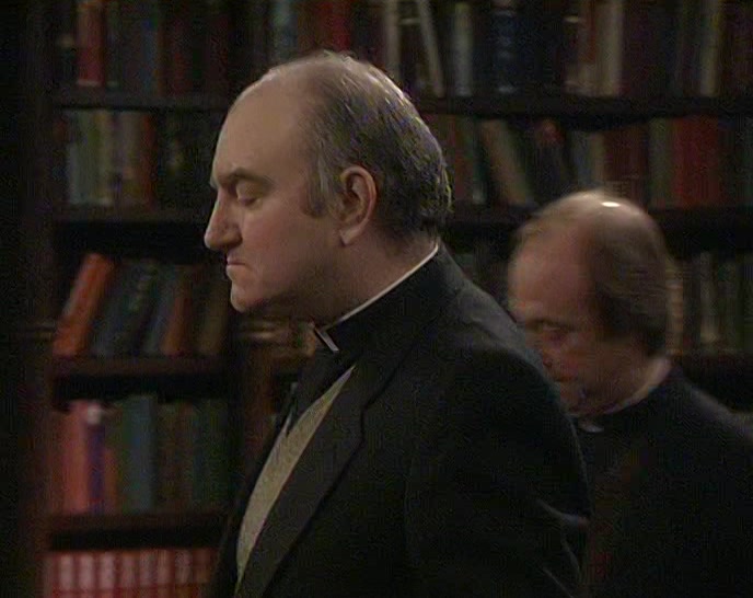 HMM... OH, YES. FATHER TOM COOGAN. WASN'T HE IN AFRICA? 