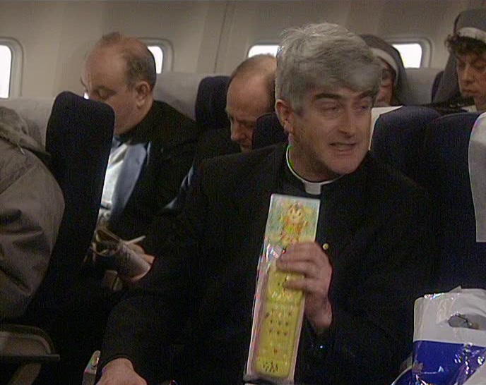 SOMEBODY HAS GIVEN HIM A RUBBER TELEPHONE THAT MAKES A NOISE! 