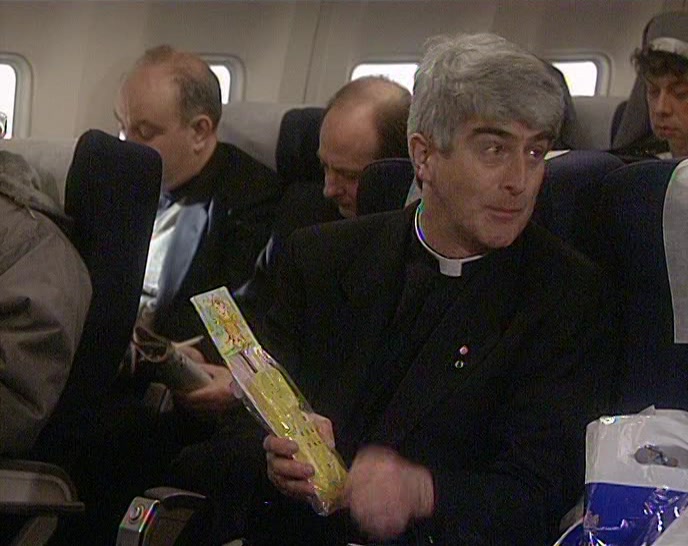 SOMEBODY HAS GIVEN HIM A RUBBER TELEPHONE THAT MAKES A NOISE! 