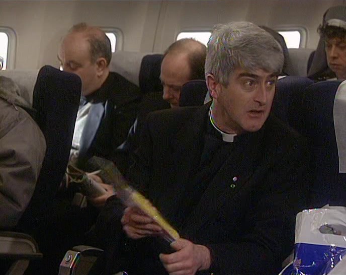 SOMEBODY HAS GIVEN HIM A RUBBER TELEPHONE THAT MAKES A NOISE! 