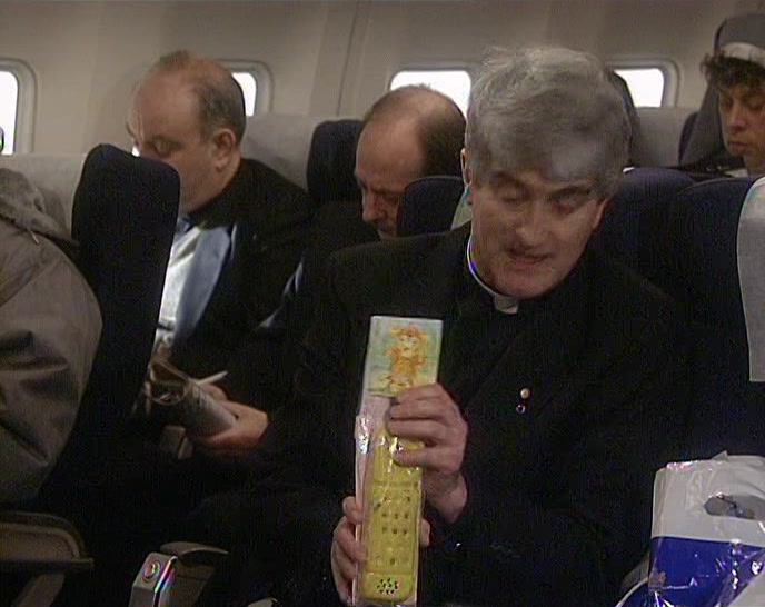 SOMEBODY HAS GIVEN HIM A RUBBER TELEPHONE THAT MAKES A NOISE! 