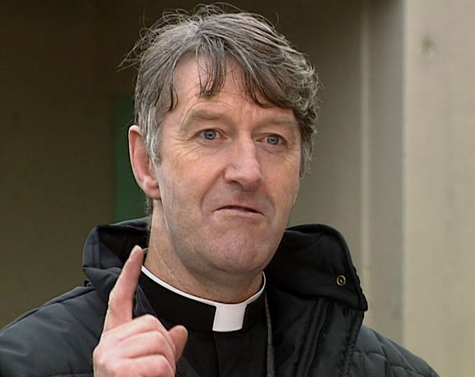 NEEDS ONLY ONE NUN TO HELP HIM GET OUT OF A CHAIR. 