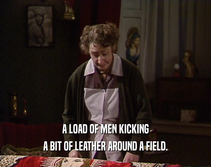 A LOAD OF MEN KICKING A BIT OF LEATHER AROUND A FIELD. 