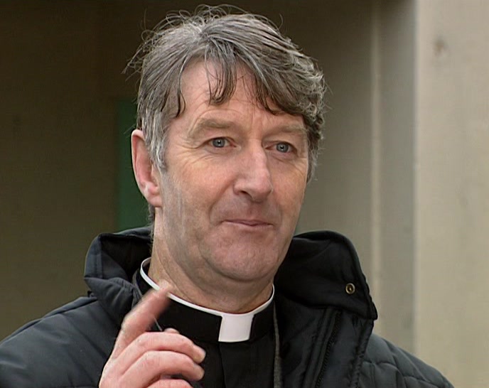 NEEDS ONLY ONE NUN TO HELP HIM GET OUT OF A CHAIR. 
