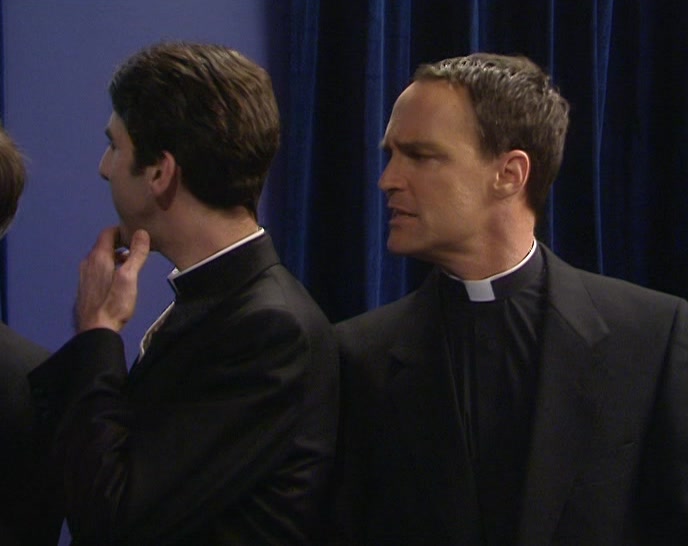 (AMERICAN ACCENT) WHO'S THE SILVER-HAIRED PRIEST? 