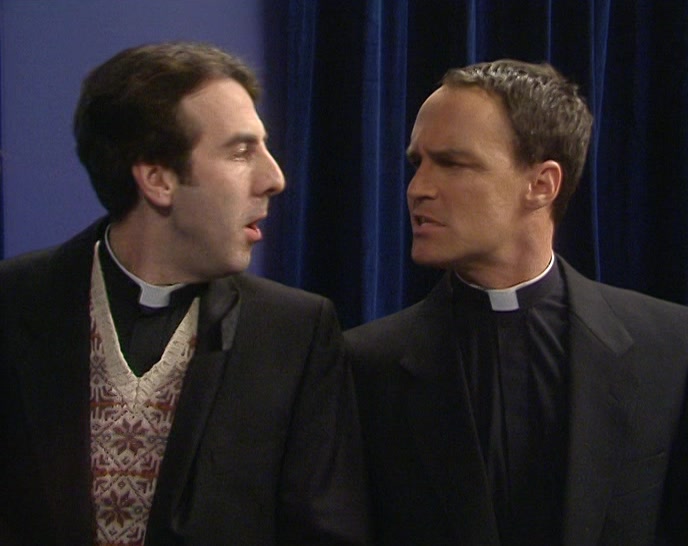 (AMERICAN ACCENT) WHO'S THE SILVER-HAIRED PRIEST? 