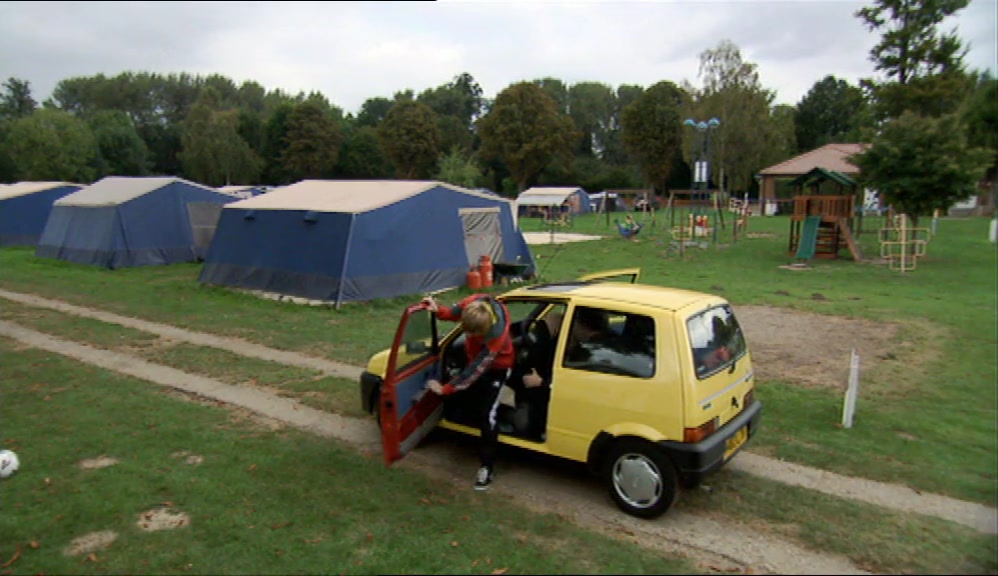 IT LOOKED LIKE A FIELD WITH SOME OLD TENTS IN IT. 