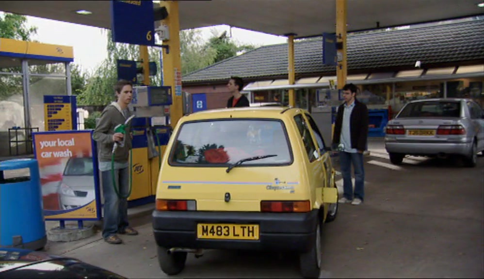 AND THOUGH SIMON COULD JUST ABOUT DRIVE A CAR, 