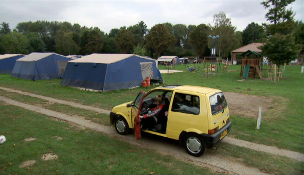IT LOOKED LIKE A FIELD WITH SOME OLD TENTS IN IT. 