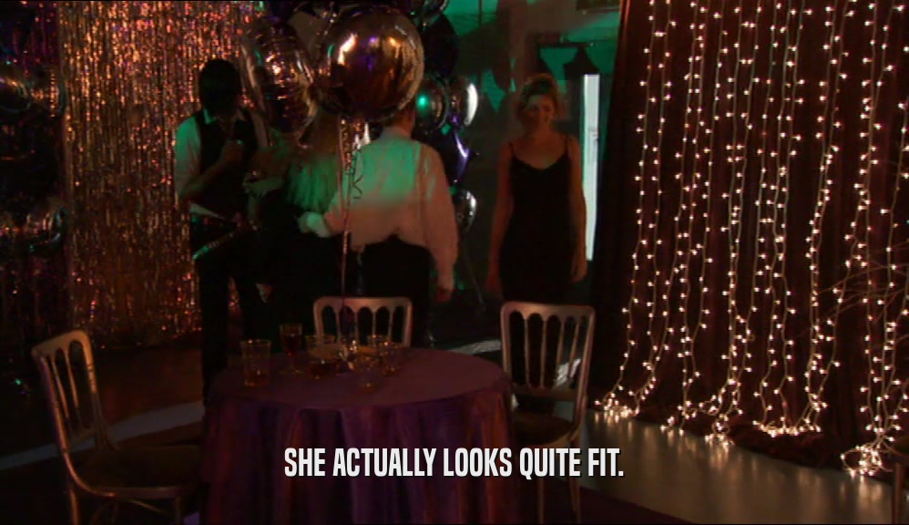 SHE ACTUALLY LOOKS QUITE FIT.  