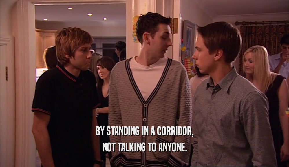 BY STANDING IN A CORRIDOR, NOT TALKING TO ANYONE. 