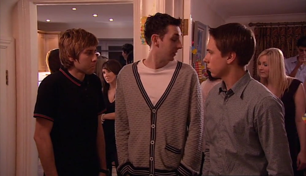 BY STANDING IN A CORRIDOR, NOT TALKING TO ANYONE. 