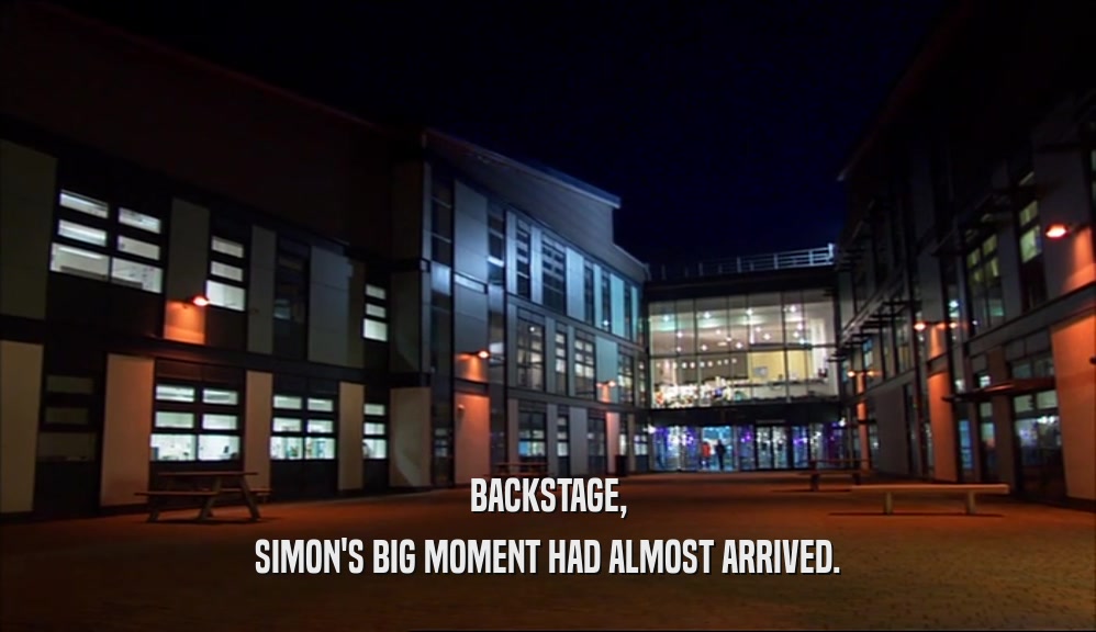 BACKSTAGE, SIMON'S BIG MOMENT HAD ALMOST ARRIVED. 
