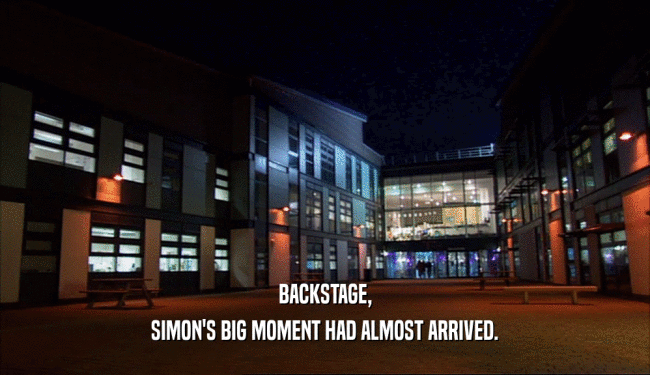 BACKSTAGE, SIMON'S BIG MOMENT HAD ALMOST ARRIVED. 