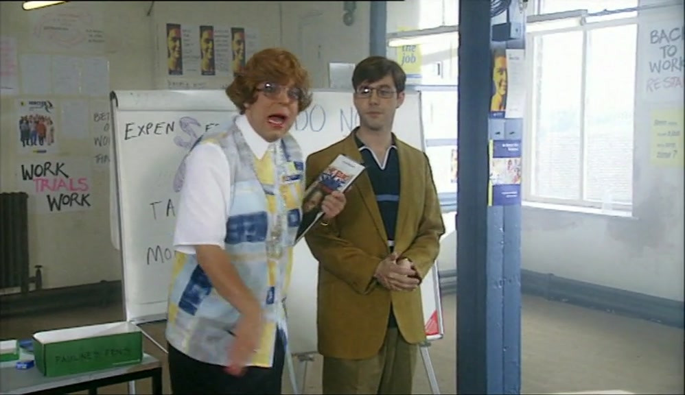 THAT WE'RE STANDING ON A BUSY HIGH STREET.  