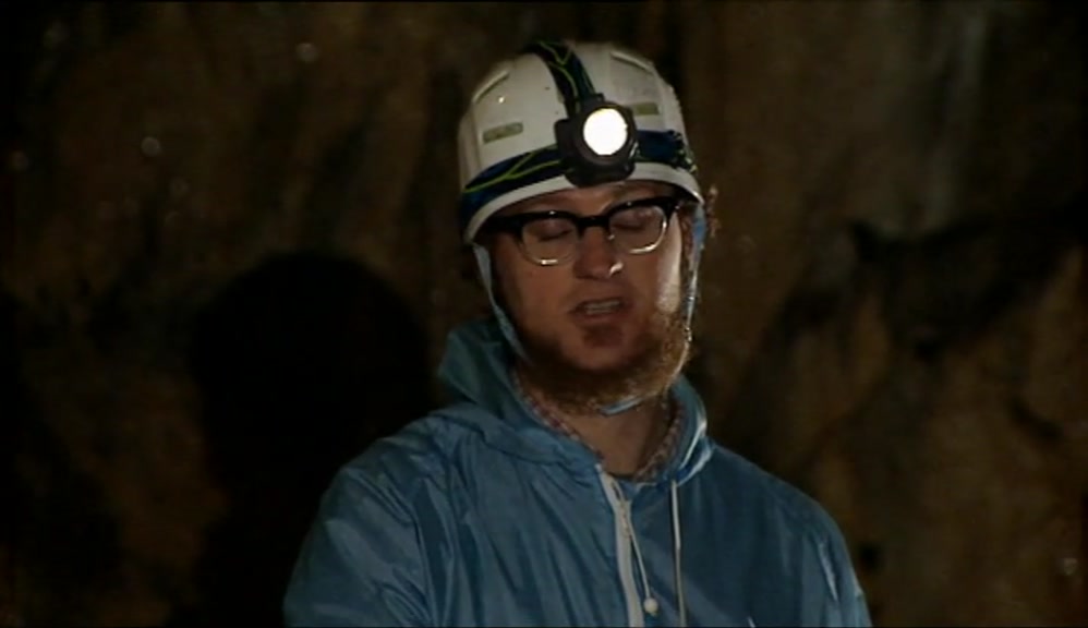 CLUTCHING AT A SLIPPERY, WET ROPE, SLIDING DOWN INTO THE DARK WATER. 