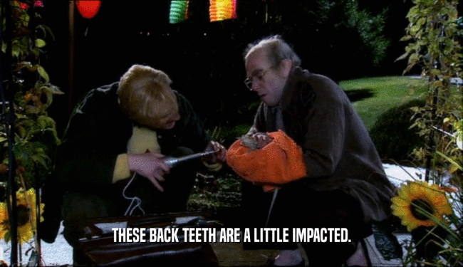 THESE BACK TEETH ARE A LITTLE IMPACTED.  