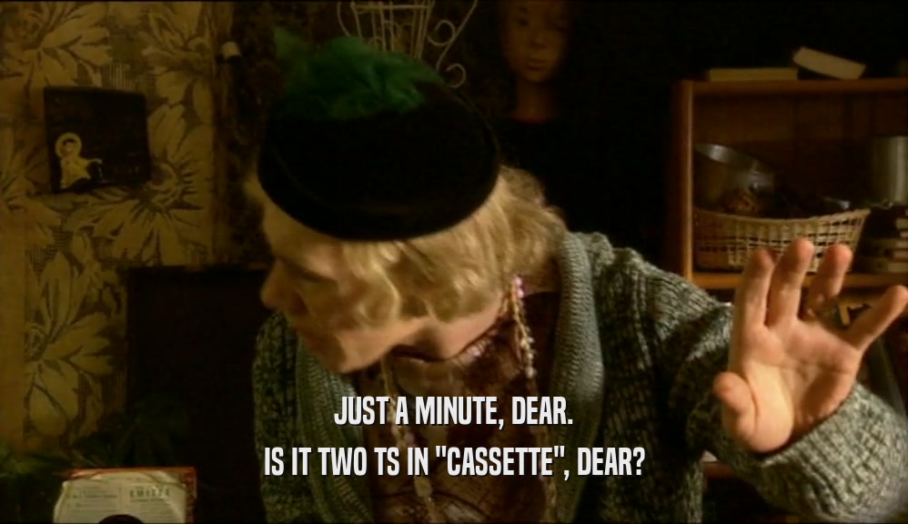 JUST A MINUTE, DEAR. IS IT TWO TS IN 