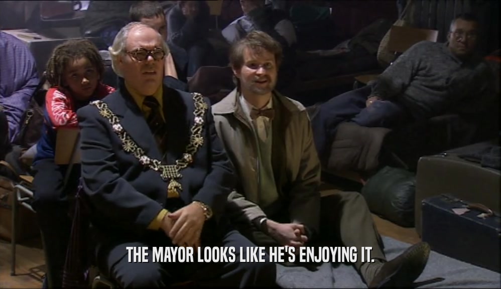 THE MAYOR LOOKS LIKE HE'S ENJOYING IT.  