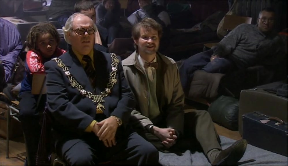 THE MAYOR LOOKS LIKE HE'S ENJOYING IT.  