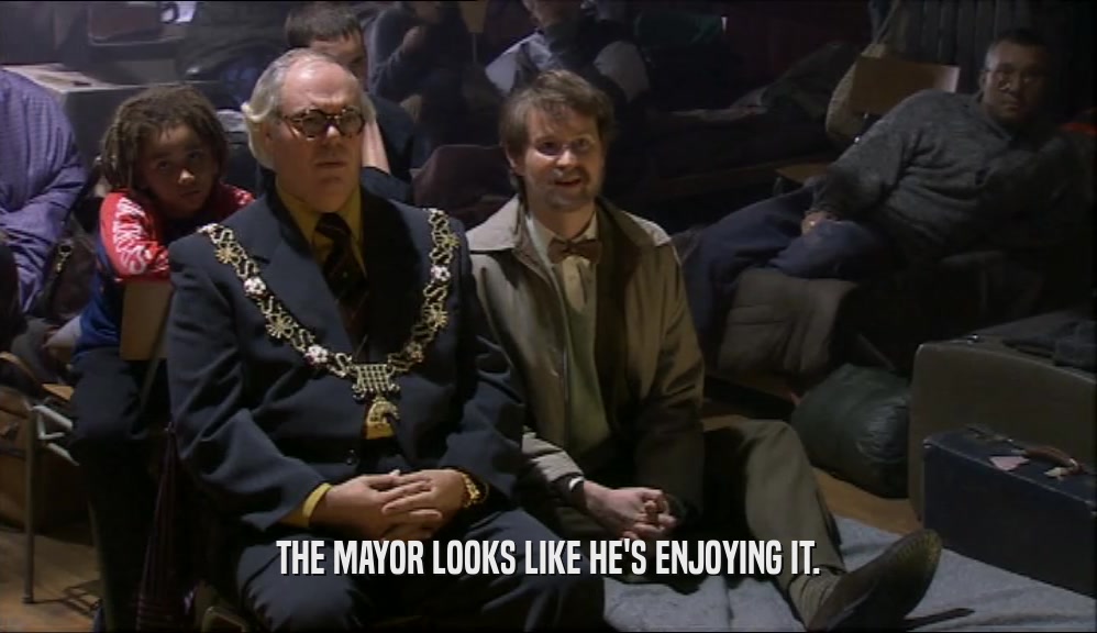 THE MAYOR LOOKS LIKE HE'S ENJOYING IT.  