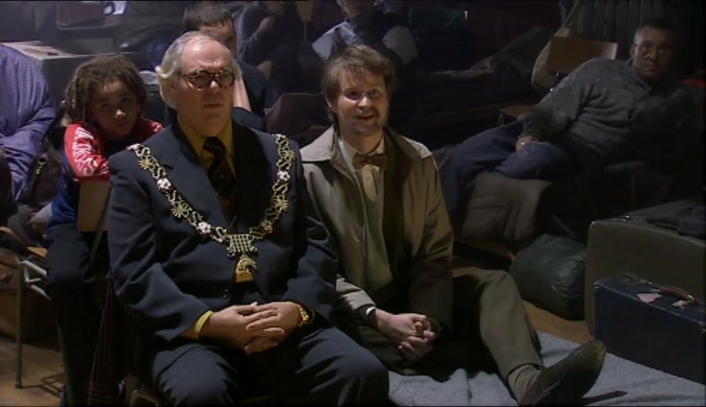 THE MAYOR LOOKS LIKE HE'S ENJOYING IT.  
