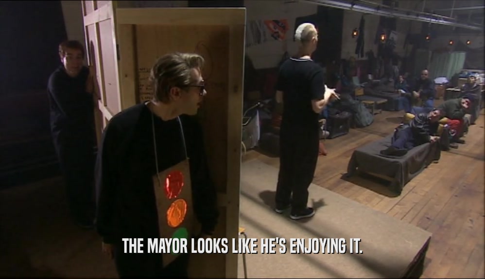THE MAYOR LOOKS LIKE HE'S ENJOYING IT.  