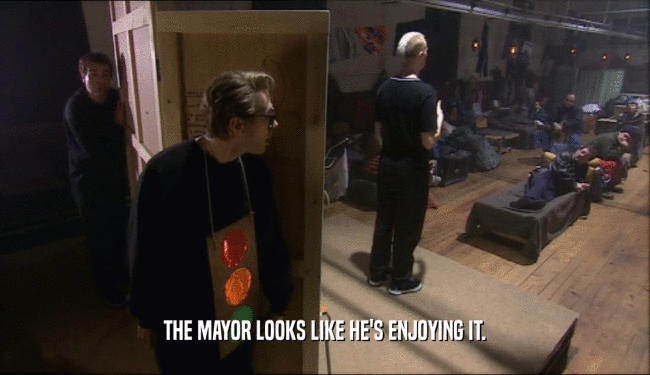 THE MAYOR LOOKS LIKE HE'S ENJOYING IT.  
