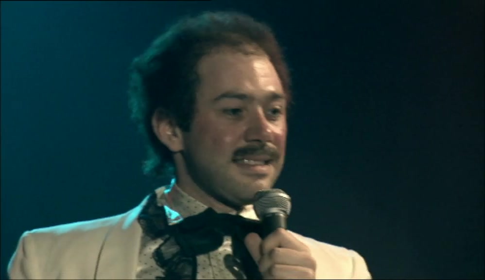 (THREE KNOCKS, WOMAN LAUGHS)  