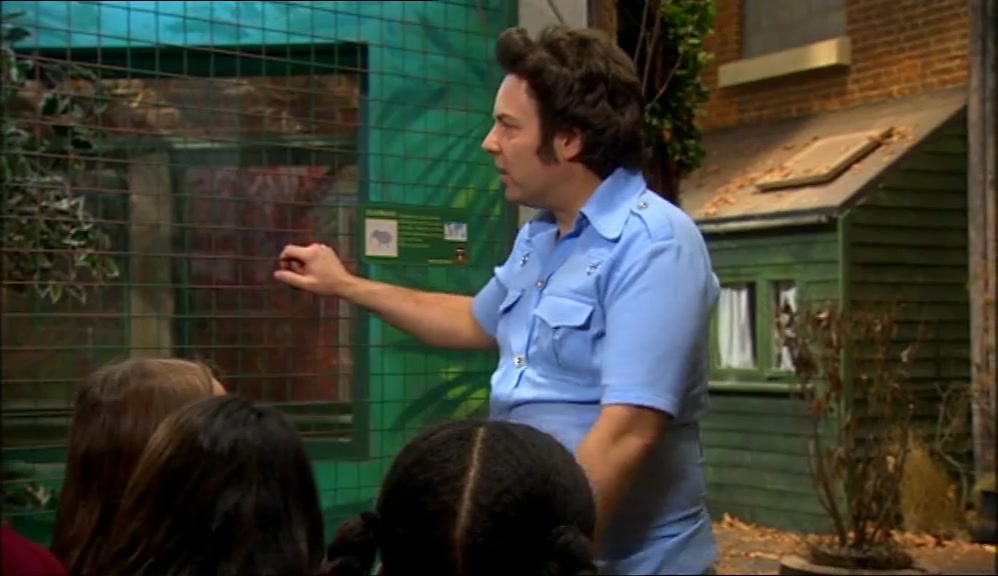 NOW, OUR FIRST STOP TODAY ON THE TOUR IS THE LARGEST ANIMAL IN THE ZOO, 