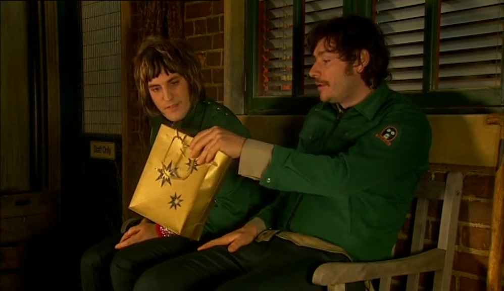 OH, WELL. I'VE GOT YOU SOMETHING. A LITTLE GIFT THERE. 