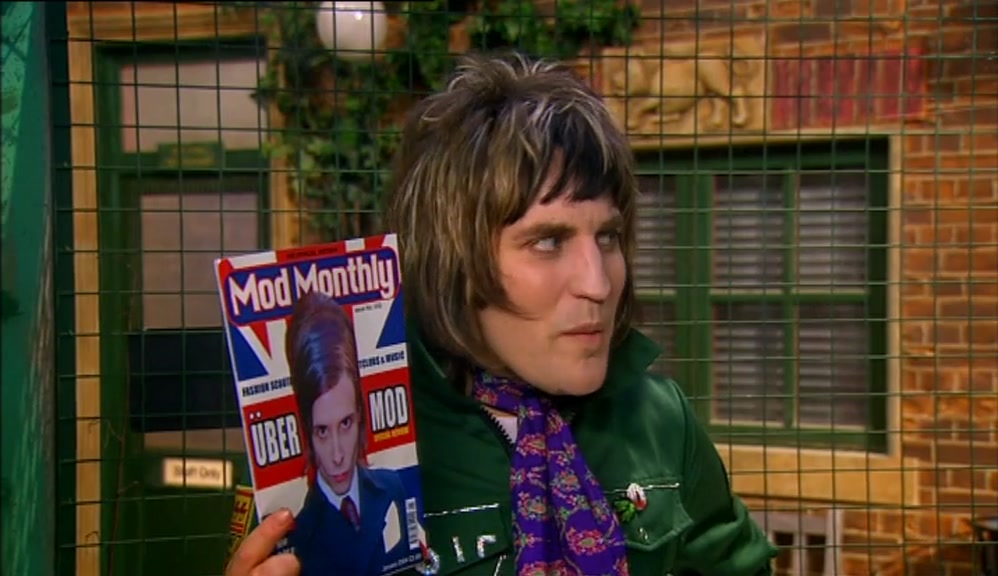 LOOK AT HIS HAIR. IT'S OVER A METRE TALL.  