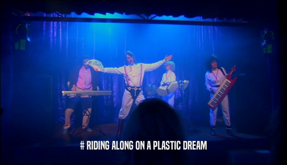 # RIDING ALONG ON A PLASTIC DREAM  