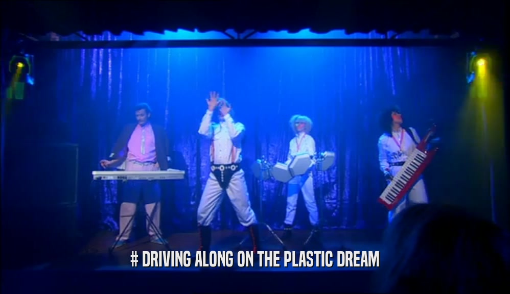 # DRIVING ALONG ON THE PLASTIC DREAM  