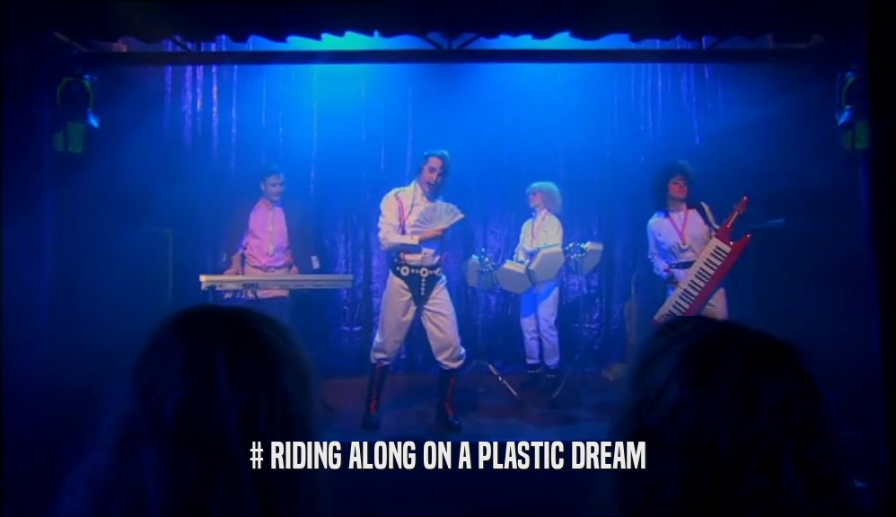 # RIDING ALONG ON A PLASTIC DREAM  