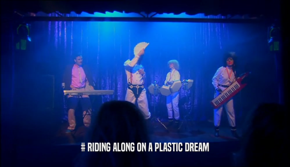 # RIDING ALONG ON A PLASTIC DREAM  