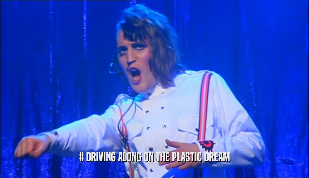 # DRIVING ALONG ON THE PLASTIC DREAM  