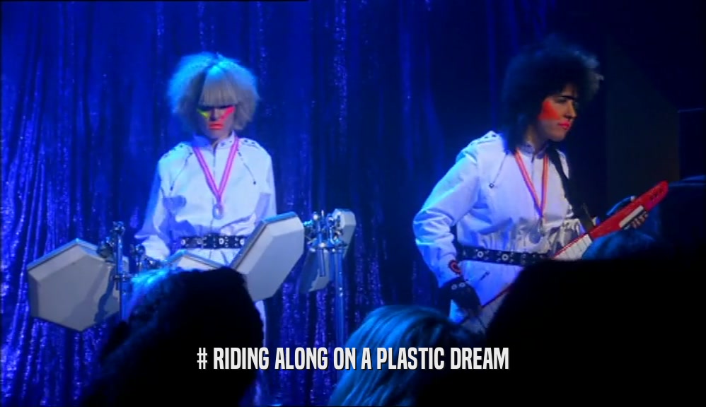 # RIDING ALONG ON A PLASTIC DREAM  