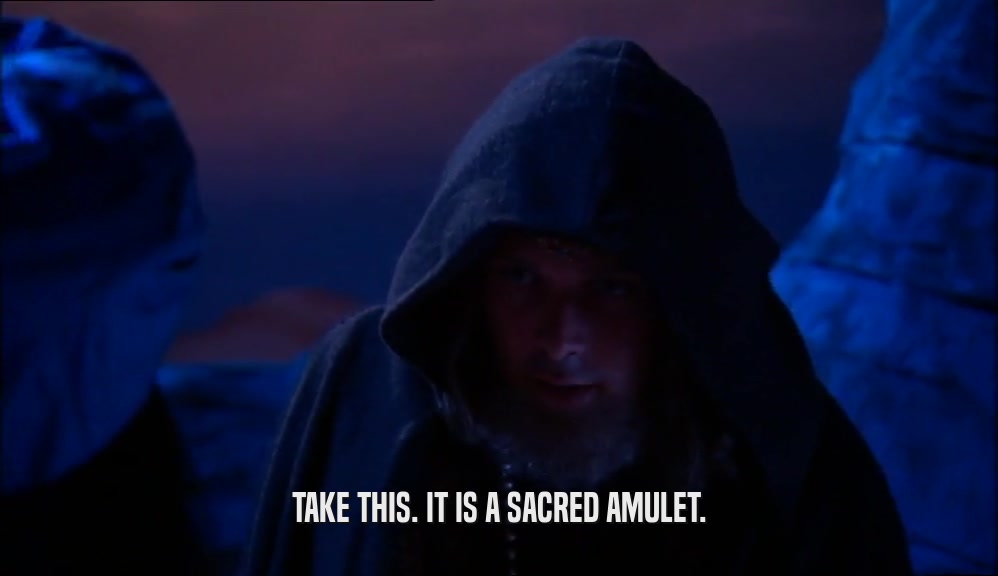TAKE THIS. IT IS A SACRED AMULET.  