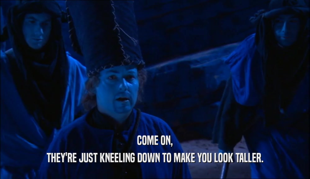 COME ON, THEY'RE JUST KNEELING DOWN TO MAKE YOU LOOK TALLER. 