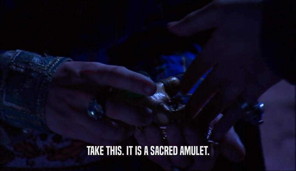 TAKE THIS. IT IS A SACRED AMULET.  