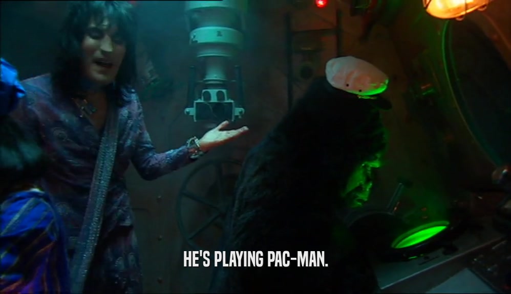 HE'S PLAYING PAC-MAN.  